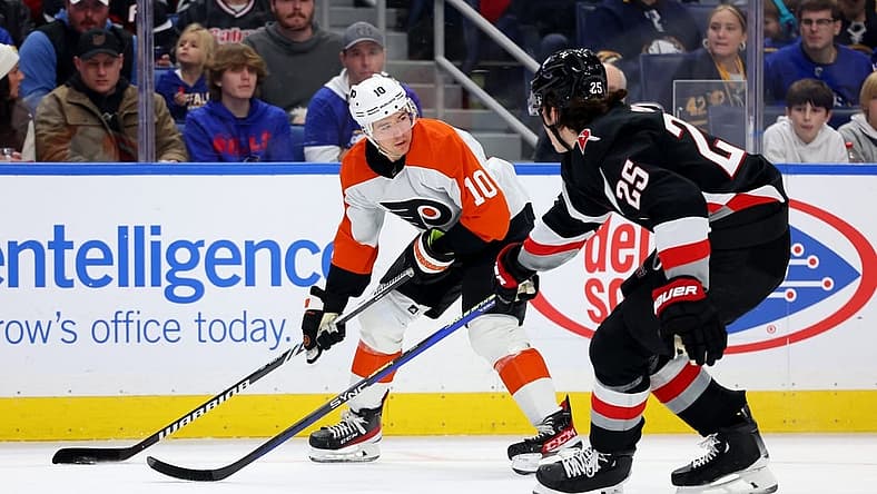 Nov 3, 2023; Buffalo, New York, USA; Philadelphia Flyers right wing Bobby Brink (10) looks to make a pass as Buffalo Sabres defenseman Owen Power (25) defends during the first period at KeyBank Center. Mandatory Credit: Timothy T. Ludwig-USA TODAY Sports