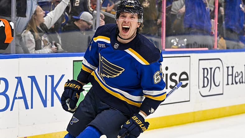 Nov 3, 2023; St. Louis, Missouri, USA; St. Louis Blues left wing Jake Neighbours (63) reacts after scoring against the New Jersey Devils during the second period at Enterprise Center. Mandatory Credit: Jeff Curry-USA TODAY Sports