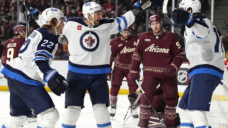 Nov 4, 2023; Tempe, Arizona, USA; Winnipeg Jets right wing Nino Niederreiter (62) celebrates with teammates after scoring a hat trick against the Arizona Coyotes in the third period at Mullett Arena. Mandatory Credit: Rick Scuteri-USA TODAY Sports