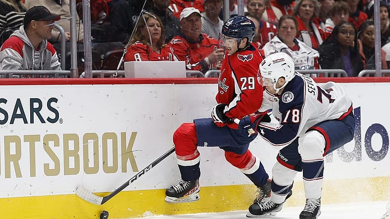 Nov 4, 2023; Washington, District of Columbia, USA; Washington Capitals center Hendrix Lapierre (29) and Columbus Blue Jackets defenseman Damon Severson (78) battle for the puck in the first period at Capital One Arena. Mandatory Credit: Geoff Burke-USA TODAY Sports
