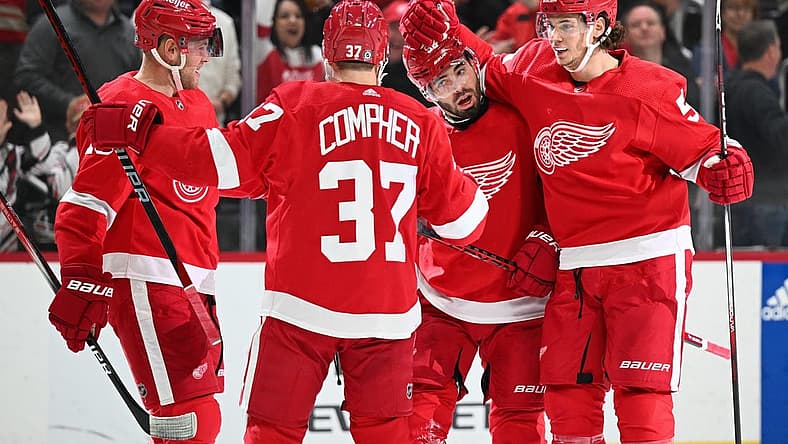 Nov 4, 2023; Detroit, Michigan, USA; Detroit Red Wings defenseman Jake Walman (96) celebrates his goal with center Andrew Copp (18) left wing J.T. Compher (37) and defenseman Moritz Seider (53) during the second period against the Boston Bruins at Little Caesars Arena. Mandatory Credit: Tim Fuller-USA TODAY Sports