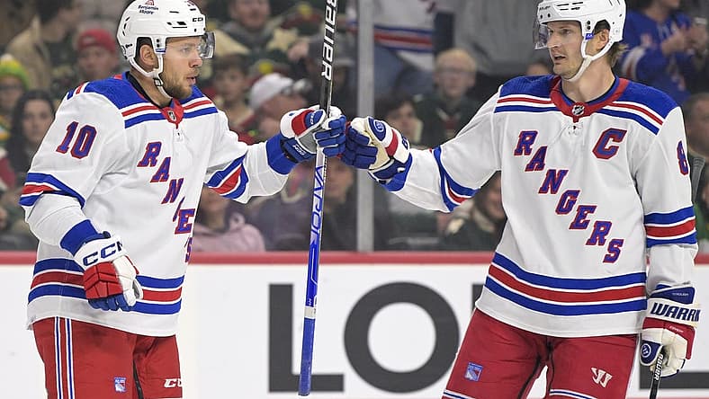 Nov 4, 2023; Saint Paul, Minnesota, USA; New York Rangers forward Artemi Panarin (10) celebrates his goal against the Minnesota Wild with defenseman Jacob Trouba (8) during the first period at Xcel Energy Center. Mandatory Credit: Nick Wosika-USA TODAY Sports
