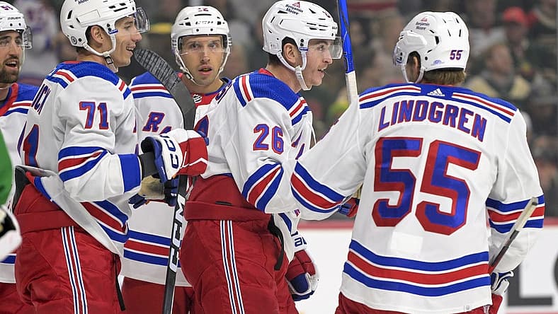 Nov 4, 2023; Saint Paul, Minnesota, USA; New York Rangers forward Jimmy Vesey (26) celebrates his goal against the Minnesota Wild with forward Tyler Pitlick (71) and defenseman Ryan Lindgren (55) during the first period at Xcel Energy Center. Mandatory Credit: Nick Wosika-USA TODAY Sports
