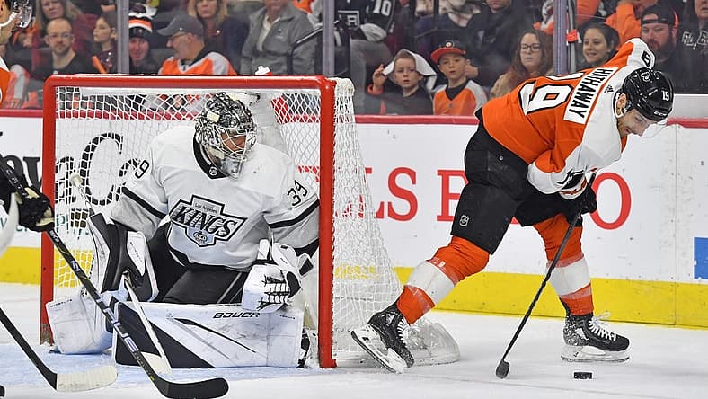 Nov 4, 2023; Philadelphia, Pennsylvania, USA; Philadelphia Flyers right wing Garnet Hathaway (19) tries to control the puck against Los Angeles Kings goaltender Cam Talbot (39) during the second period at Wells Fargo Center. Mandatory Credit: Eric Hartline-USA TODAY Sports