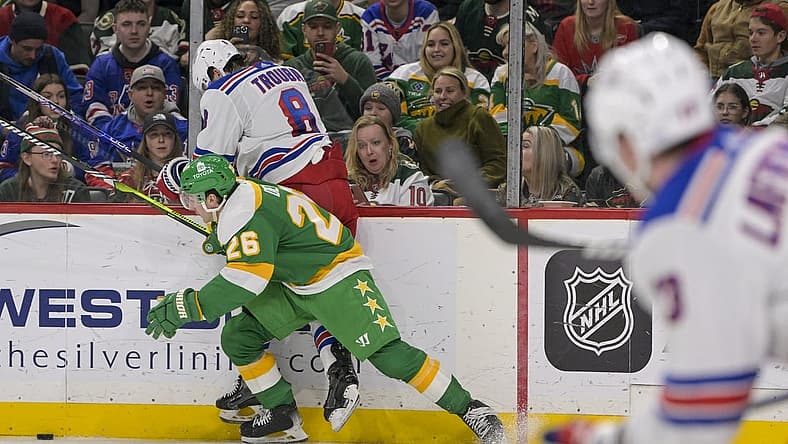 Nov 4, 2023; Saint Paul, Minnesota, USA; Minnesota Wild forward Connor Dewar (26) bumps New York Rangers defenseman Jacob Trouba (8) off of the puck during the second period at Xcel Energy Center. Mandatory Credit: Nick Wosika-USA TODAY Sports