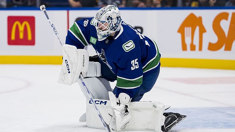 Nov 4, 2023; Vancouver, British Columbia, CAN; Vancouver Canucks goalie Thatcher Demko (35) handles the puck against the Dallas Stars in the second period at Rogers Arena. Mandatory Credit: Bob Frid-USA TODAY Sports