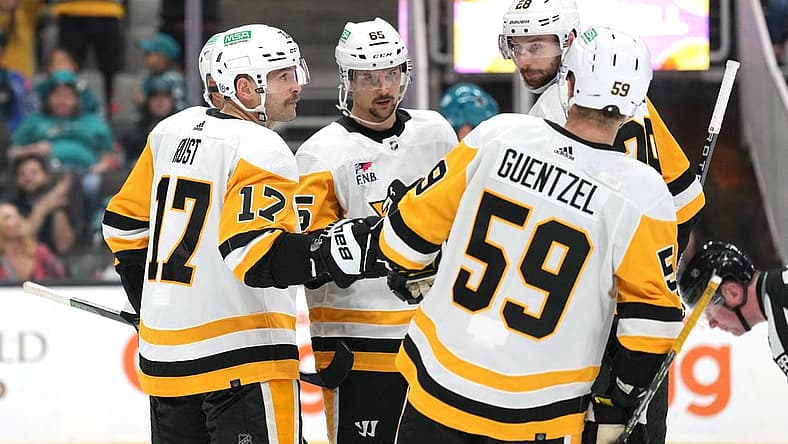 Nov 4, 2023; San Jose, California, USA; Pittsburgh Penguins right wing Bryan Rust (17) celebrates with teammates after scoring a goal against the San Jose Sharks during the third period at SAP Center at San Jose. Mandatory Credit: Darren Yamashita-USA TODAY Sports