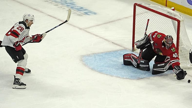 Nov 5, 2023; Chicago, Illinois, USA; Chicago Blackhawks goaltender Arvid Soderblom (40) makes a save on New Jersey Devils right wing Timo Meier (28) during the first period at United Center. Mandatory Credit: David Banks-USA TODAY Sports