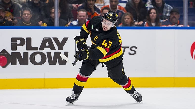 Nov 6, 2023; Vancouver, British Columbia, CAN; Vancouver Canucks defenseman Quinn Hughes (43) shoots against the Edmonton Oilers in the third period at Rogers Arena. Mandatory Credit: Bob Frid-USA TODAY Sports