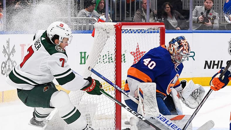 Nov 7, 2023; Elmont, New York, USA; New York Islanders goaltender Semyon Varlamov (40) makes a save against Minnesota Wild defenseman Brock Faber (7) during the first period at UBS Arena. Mandatory Credit: Dennis Schneidler-USA TODAY Sports
