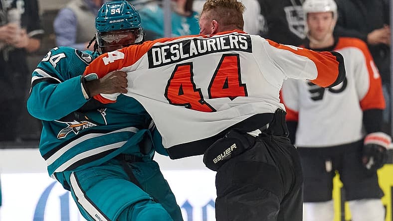 Nov 7, 2023; San Jose, California, USA; Philadelphia Flyers left wing Nicolas Deslauriers (44) fights with San Jose Sharks right wing Givani Smith (54) during the first period at SAP Center at San Jose. Mandatory Credit: Robert Edwards-USA TODAY Sports