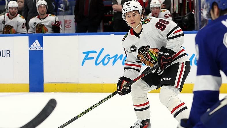 Nov 9, 2023; Tampa, Florida, USA; Chicago Blackhawks center Connor Bedard (98) skates with the puck against the Tampa Bay Lightning during the second period at Amalie Arena. Mandatory Credit: Kim Klement Neitzel-USA TODAY Sports
