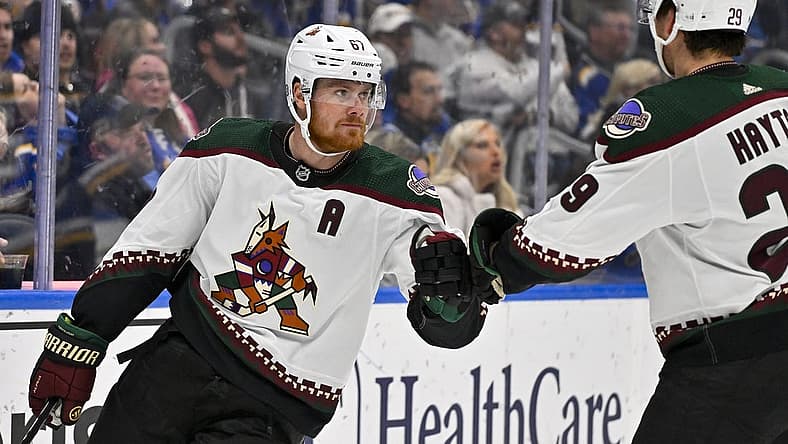 Nov 9, 2023; St. Louis, Missouri, USA;  Arizona Coyotes left wing Lawson Crouse (67) is congratulated by center Barrett Hayton (29) after scoring against the St. Louis Blues during the first period at Enterprise Center. Mandatory Credit: Jeff Curry-USA TODAY Sports