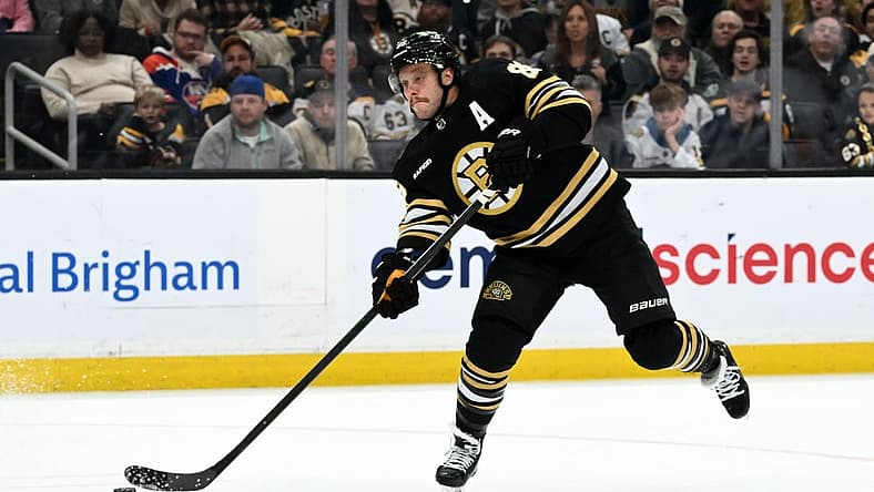 Nov 9, 2023; Boston, Massachusetts, USA; Boston Bruins right wing David Pastrnak (88) takes a shot against the New York Islanders during the third period at the TD Garden. Mandatory Credit: Brian Fluharty-USA TODAY Sports