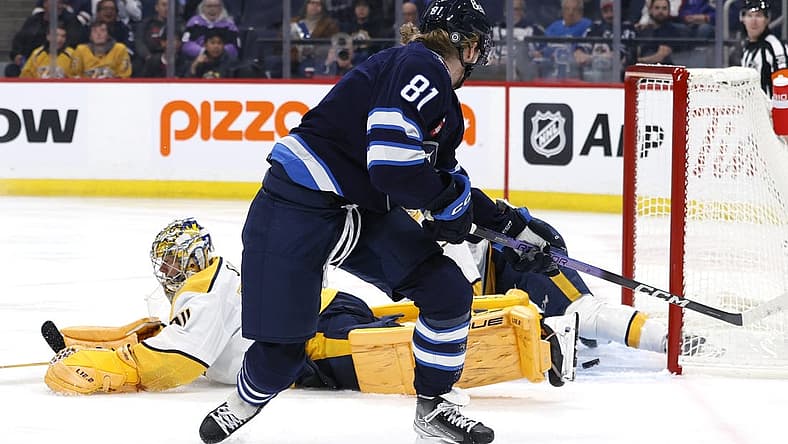 Nov 9, 2023; Winnipeg, Manitoba, CAN; Winnipeg Jets left wing Kyle Connor (81) scores on Nashville Predators goaltender Juuse Saros (74) in the second period at Canada Life Centre. Mandatory Credit: James Carey Lauder-USA TODAY Sports