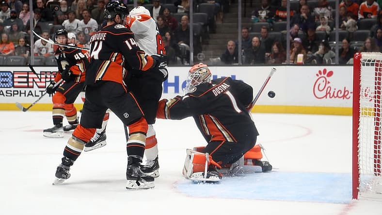 Nov 10, 2023; Anaheim, California, USA; Anaheim Ducks goaltender Lukas Dostal (1) gives up a goal against Philadelphia Flyers right wing Cam Atkinson (89) during the first period at Honda Center. Mandatory Credit: Kiyoshi Mio-USA TODAY Sports