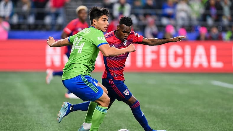 Nov 10, 2023; Seattle, Washington, USA; Seattle Sounders midfielder Josh Atencio (84) looks for a pass as FC Dallas forward J der Obrian (8) defends during the first half at Lumen Field. Mandatory Credit: Steven Bisig-USA TODAY Sports