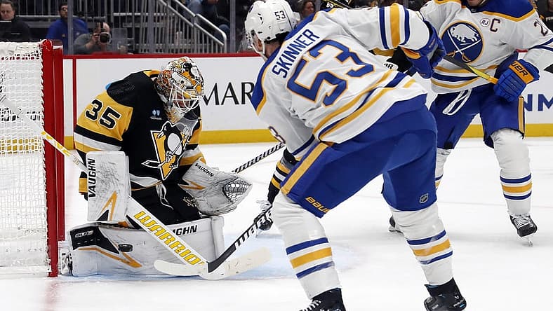 Nov 11, 2023; Pittsburgh, Pennsylvania, USA; Pittsburgh Penguins goaltender Tristan Jarry (35) makes a save against Buffalo Sabres left wing Jeff Skinner (53) during the second period at PPG Paints Arena. Mandatory Credit: Charles LeClaire-USA TODAY Sports