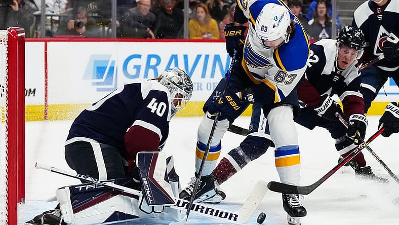 Nov 11, 2023; Denver, Colorado, USA; Colorado Avalanche goaltender Alexandar Georgiev (40) makes a save on St. Louis Blues left wing Jake Neighbours (63) in the first period at Ball Arena. Mandatory Credit: Ron Chenoy-USA TODAY Sports