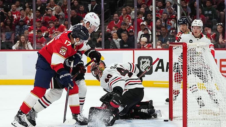 Nov 12, 2023; Sunrise, Florida, USA; Chicago Blackhawks goaltender Arvid Soderblom (40) allows a goal to Florida Panthers center Sam Reinhart (13) during the second period at Amerant Bank Arena. Mandatory Credit: Jasen Vinlove-USA TODAY Sports