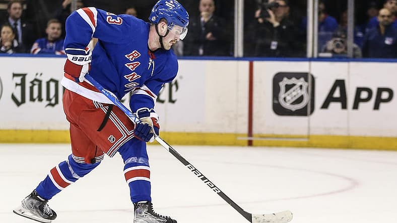 Nov 12, 2023; New York, New York, USA; New York Rangers left wing Alexis Lafreniere (13) scores the game winning goal in a shootout against the Columbus Blue Jackets at Madison Square Garden. Mandatory Credit: Wendell Cruz-USA TODAY Sports