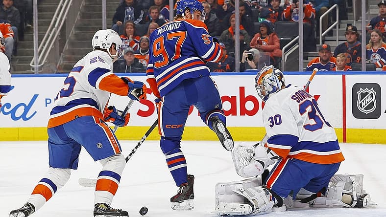 Nov 13, 2023; Edmonton, Alberta, CAN; Edmonton Oilers forward Connor McDavid (97) tries to deflect a shot past New York Islanders goaltender Ilya Sorokin (30) during the first periodat Rogers Place. Mandatory Credit: Perry Nelson-USA TODAY Sports