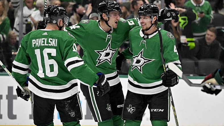 Nov 14, 2023; Dallas, Texas, USA; Dallas Stars center Joe Pavelski (16) and center Roope Hintz (24) and defenseman Miro Heiskanen (4) celebrates a power play goal scored by Hintz against the Arizona Coyotes during the second period at the American Airlines Center. Mandatory Credit: Jerome Miron-USA TODAY Sports