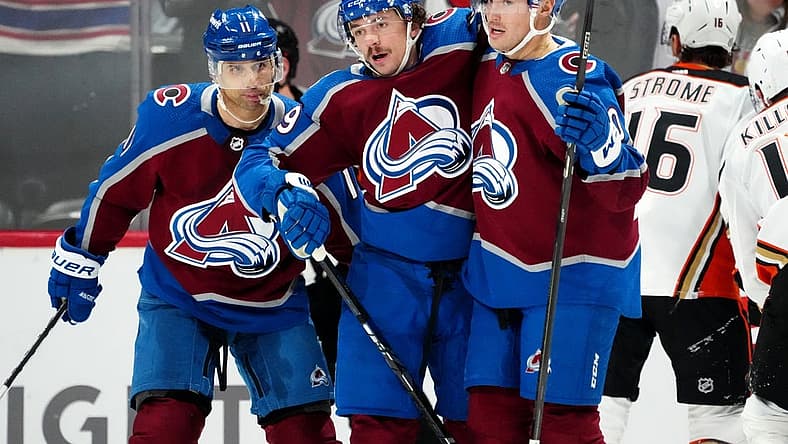 Nov 15, 2023; Denver, Colorado, USA; Colorado Avalanche defenseman Samuel Girard (49) celebrates his goal with center Ross Colton (20) and center Andrew Cogliano (11) in the first period at Ball Arena. Mandatory Credit: Ron Chenoy-USA TODAY Sports