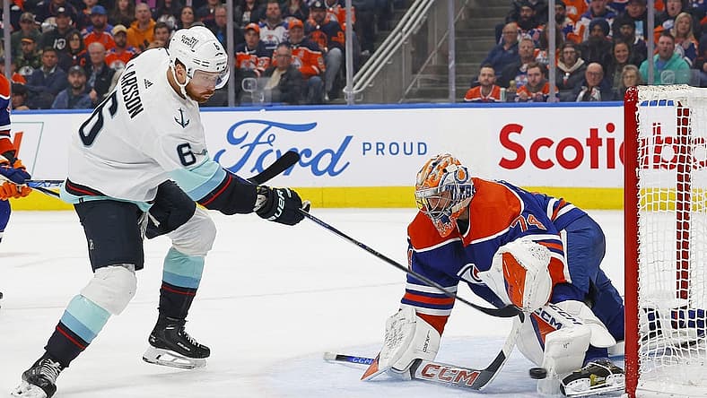 Nov 15, 2023; Edmonton, Alberta, CAN; Edmonton Oilers goaltender Stuart Skinner (74) makes a save on a shot by Seattle Kraken defensemen Adam Larsson (6) during the second period at Rogers Place. Mandatory Credit: Perry Nelson-USA TODAY Sports