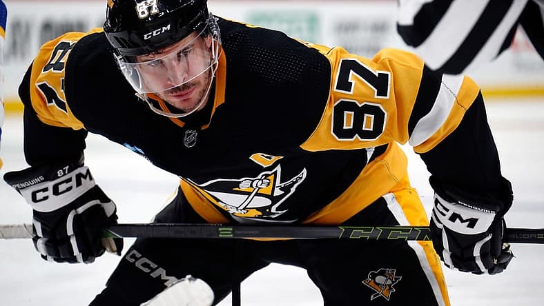 Nov 11, 2023; Pittsburgh, Pennsylvania, USA; Pittsburgh Penguins center Sidney Crosby (87) prepares to take a face-off against the Buffalo Sabres during the third period at PPG Paints Arena. Mandatory Credit: Charles LeClaire-USA TODAY Sports