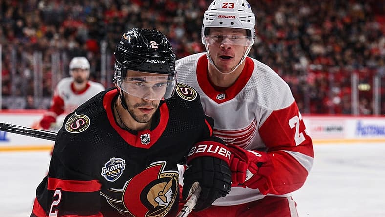 Nov 16, 2023; Stockholm, SWE; Ottawa Senators defenseman Artem Zub (2) and Detroit Red Wings left wing Lucas Raymond (23) battle for position during a Global Series NHL hockey game at Avicii Arena. Mandatory Credit: Per Haljestam-USA TODAY Sports