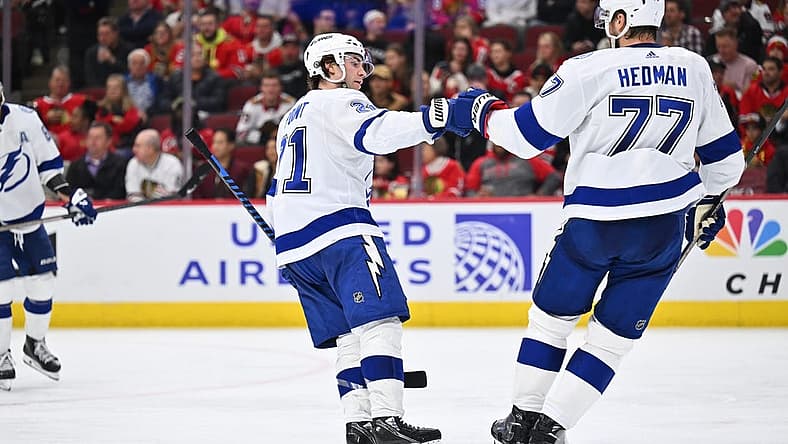 Nov 16, 2023; Chicago, Illinois, USA; Tampa Bay Lightning forward Brayden Point (21) celebrates with defenseman Victor Hedman (77) after scoring a goal in the second period against the Chicago Blackhawks at United Center. Mandatory Credit: Jamie Sabau-USA TODAY Sports