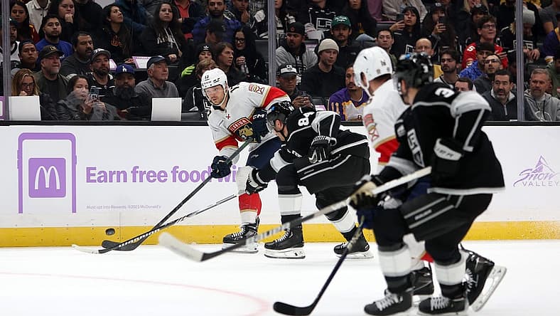 Nov 16, 2023; Los Angeles, California, USA; Florida Panthers center Sam Reinhart (13) passes the puck during the first period against the Los Angeles Kings at Crypto.com Arena. Mandatory Credit: Kiyoshi Mio-USA TODAY Sports