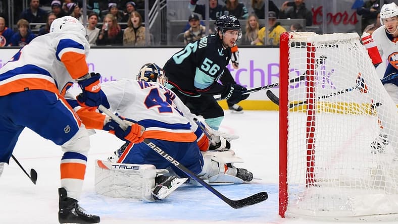 Nov 16, 2023; Seattle, Washington, USA; Seattle Kraken right wing Kailer Yamamoto (56) scores a goal past New York Islanders goaltender Semyon Varlamov (40) during the third period at Climate Pledge Arena. Mandatory Credit: Steven Bisig-USA TODAY Sports