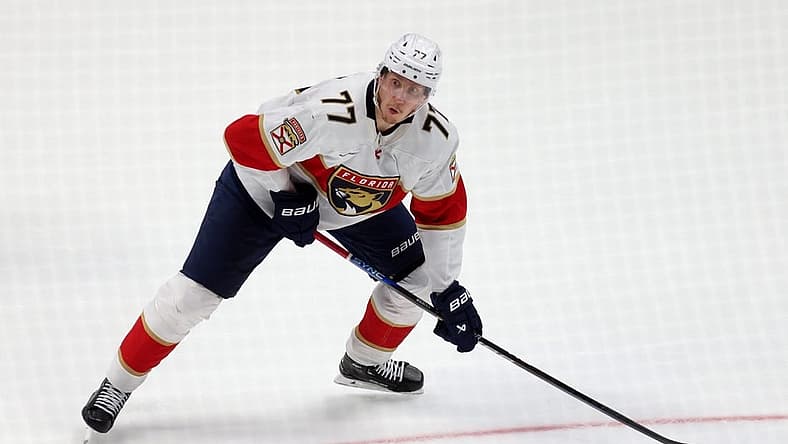 Nov 17, 2023; Anaheim, California, USA; Florida Panthers defenseman Niko Mikkola (77) shoots during the second period against the Anaheim Ducks at Honda Center. Mandatory Credit: Jason Parkhurst-USA TODAY Sports