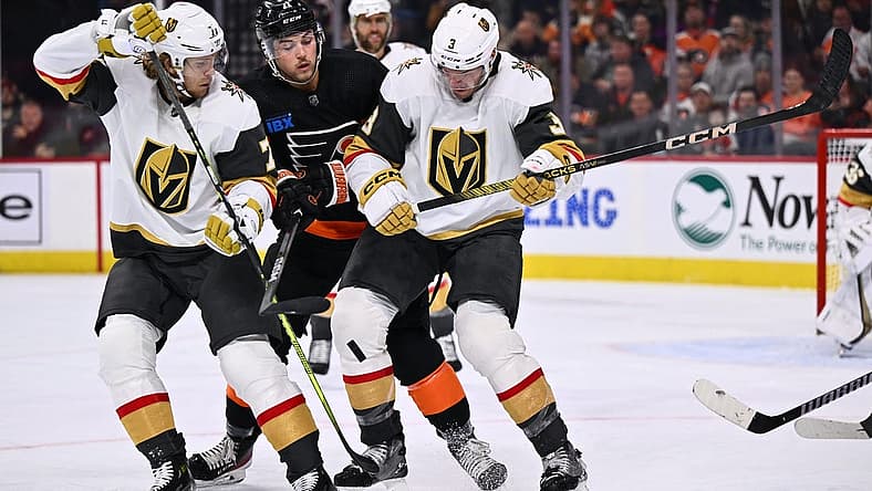 Nov 18, 2023; Philadelphia, Pennsylvania, USA; Vegas Golden Knights defenseman Brayden McNabb (3) and center William Karlsson (71) battle for the puck with Philadelphia Flyers right wing Tyson Foerster (71) in the second period at Wells Fargo Center. Mandatory Credit: Kyle Ross-USA TODAY Sports