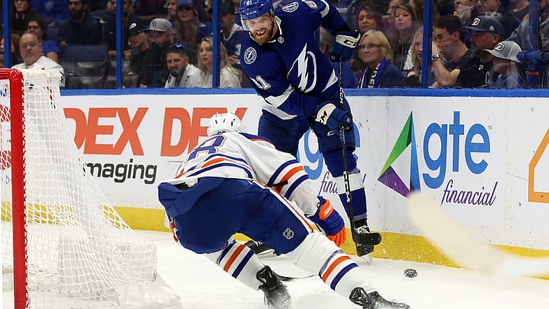 Nov 18, 2023; Tampa, Florida, USA; Tampa Bay Lightning defenseman Erik Cernak (81) passes the puck s Edmonton Oilers right wing Connor Brown (28) defends during the second period at Amalie Arena. Mandatory Credit: Kim Klement Neitzel-USA TODAY Sports