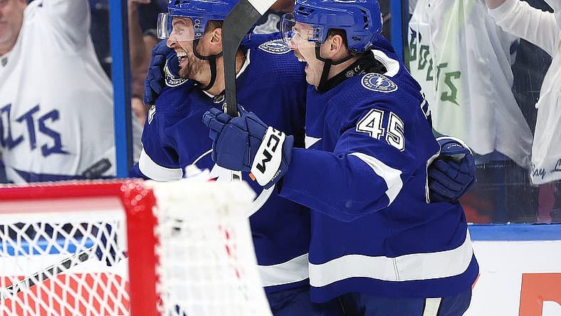 Nov 18, 2023; Tampa, Florida, USA; Tampa Bay Lightning center Luke Glendening (11) is congratulated after he scored goal against the Edmonton Oilers during the third period at Amalie Arena. Mandatory Credit: Kim Klement Neitzel-USA TODAY Sports