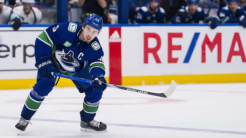 Nov 18, 2023; Vancouver, British Columbia, CAN; Vancouver Canucks defenseman Quinn Hughes (43) makes a pass against the Seattle Kraken in the third period at Rogers Arena. Seattle won 4-3. Mandatory Credit: Bob Frid-USA TODAY Sports