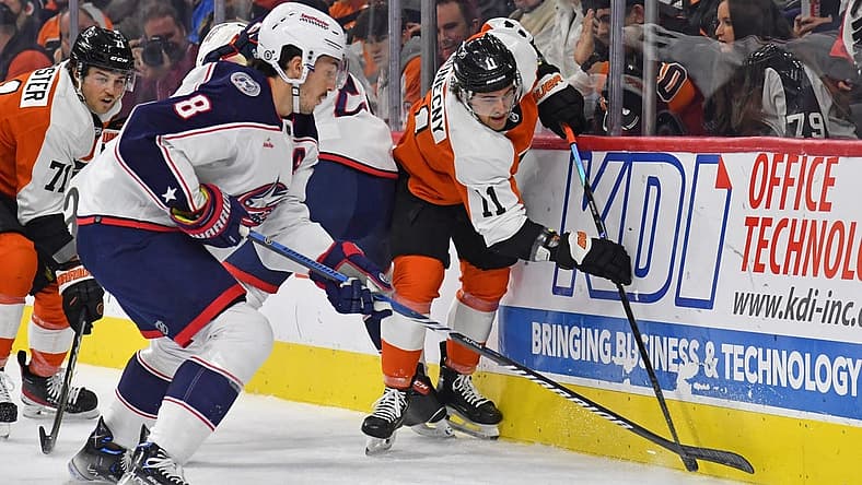 Nov 19, 2023; Philadelphia, Pennsylvania, USA; Columbus Blue Jackets defenseman Zach Werenski (8) and Philadelphia Flyers right wing Travis Konecny (11) battle for the puck during the first period at Wells Fargo Center. Mandatory Credit: Eric Hartline-USA TODAY Sports