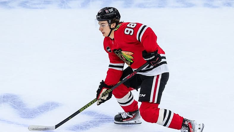 Nov 19, 2023; Chicago, Illinois, USA; Chicago Blackhawks center Connor Bedard (98) skates with the puck against the Buffalo Sabres during the third period at the United Center. Mandatory Credit: Daniel Bartel-USA TODAY Sports