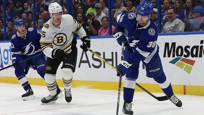 Nov 20, 2023; Tampa, Florida, USA; Tampa Bay Lightning left wing Brandon Hagel (38) passes the puck against the Boston Bruins during the first period at Amalie Arena. Mandatory Credit: Kim Klement Neitzel-USA TODAY Sports