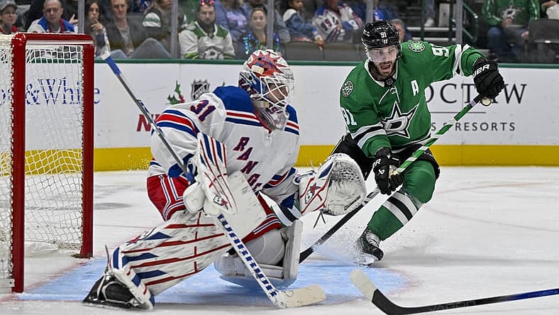 Nov 20, 2023; Dallas, Texas, USA; Dallas Stars center Tyler Seguin (91) calls for the puck in front of New York Rangers goaltender Igor Shesterkin (31) during the second period at the American Airlines Center. Mandatory Credit: Jerome Miron-USA TODAY Sports