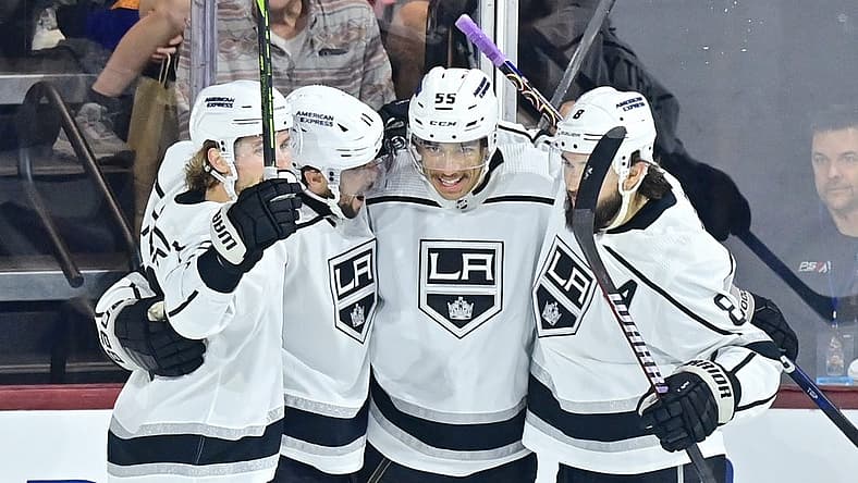 Nov 20, 2023; Tempe, Arizona, USA; Los Angeles Kings center Anze Kopitar (11) celebrates with defenseman Drew Doughty (8), center Quinton Byfield (55) and center Adrian Kempe (9) after scoring a goal against the  Arizona Coyotes in the first period at Mullett Arena. Mandatory Credit: Matt Kartozian-USA TODAY Sports