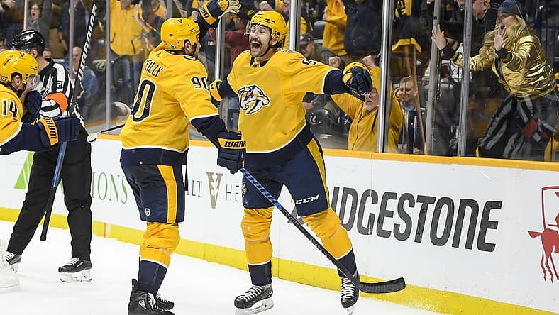 Nov 20, 2023; Nashville, Tennessee, USA; Nashville Predators left wing Filip Forsberg (9) celebrates as he scores the timing goal late against the Colorado Avalanche during the third period at Bridgestone Arena. Mandatory Credit: Steve Roberts-USA TODAY Sports