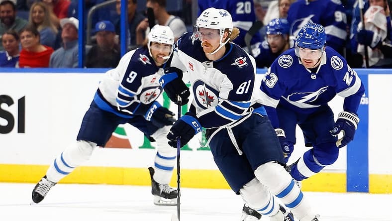 Nov 22, 2023; Tampa, Florida, USA; Winnipeg Jets left wing Kyle Connor (81) handles the puck during the second period against the Tampa Bay Lightning at Amalie Arena. Mandatory Credit: Douglas DeFelice-USA TODAY Sports
