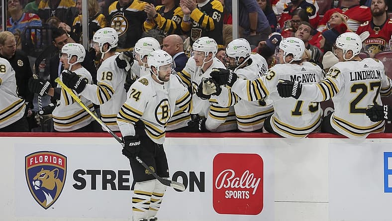 Nov 22, 2023; Sunrise, Florida, USA; Boston Bruins left wing Jake DeBrusk (74) celebrates with teammates after scoring against the Florida Panthers during the second period at Amerant Bank Arena. Mandatory Credit: Sam Navarro-USA TODAY Sports