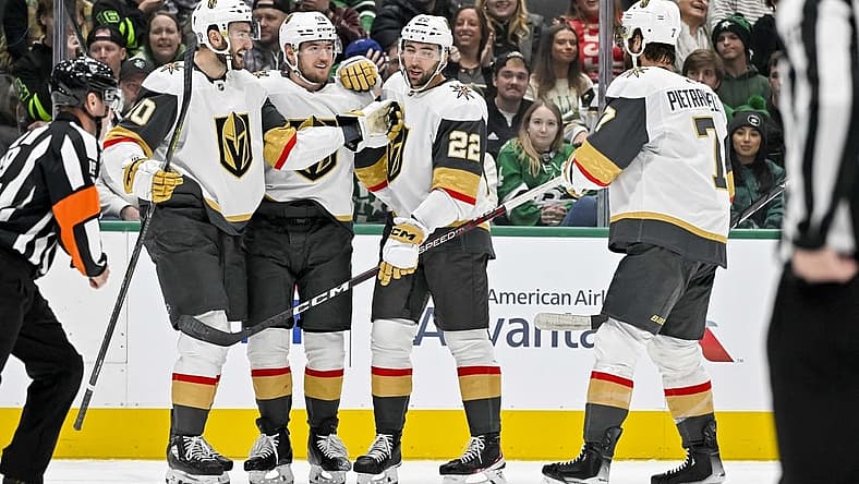 Nov 22, 2023; Dallas, Texas, USA; Vegas Golden Knights center Nicolas Roy (10) and right wing Michael Amadio (22) and center Ivan Barbashev (49) and defenseman Alex Pietrangelo (7) celebrates a goal scored by Amadio against the Dallas Stars during the first period at the American Airlines Center. Mandatory Credit: Jerome Miron-USA TODAY Sports