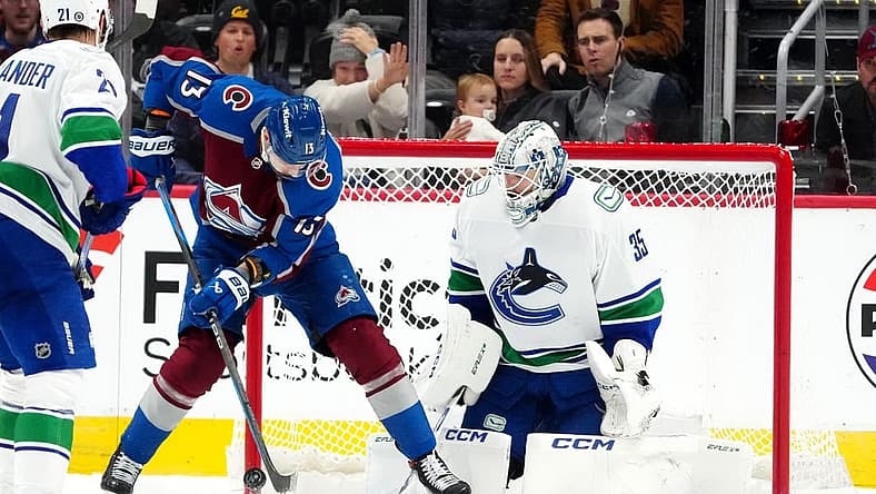 Nov 22, 2023; Denver, Colorado, USA; Colorado Avalanche right wing Valeri Nichushkin (13) shoots the puck at Vancouver Canucks goaltender Thatcher Demko (35) in the first period at Ball Arena. Mandatory Credit: Ron Chenoy-USA TODAY Sports