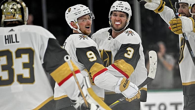 Nov 22, 2023; Dallas, Texas, USA; Vegas Golden Knights center Jack Eichel (9) and defenseman Brayden McNabb (3) and goaltender Adin Hill (33) celebrate after Eichel scores the game winning goal against the Dallas Stars during the overtime period at the American Airlines Center. Mandatory Credit: Jerome Miron-USA TODAY Sports
